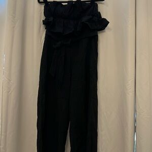Flirty jumpsuit with ruffled top and tie back